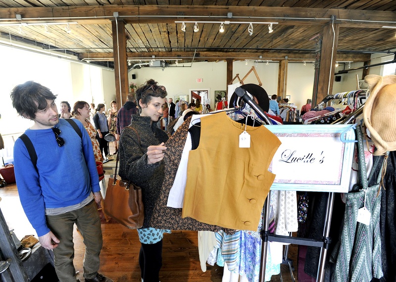 Shoppers browse at the Flea for All market in Portland on April 14. On Monday night, the City Council reduced the licensing fee for flea market operators to $225 a year, from $50 a day, and reduced the annual fee for individual sellers to $20, by eliminating a $35 administrative fee.