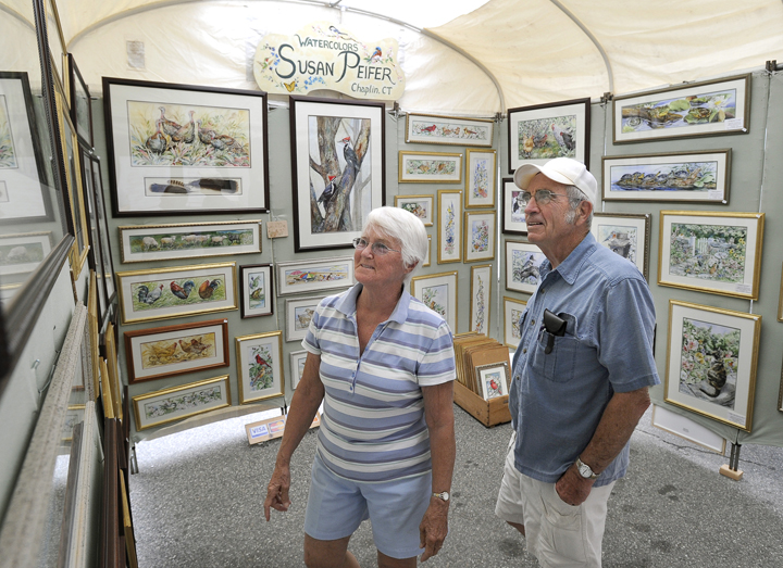 Joanne and Dan Allen of Saco view art on display today as part of a sidewalk art show highlighting Saco's 250th Anniversary Celebration.