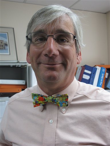 In this photo taken Thursday, May 31, 2012, in Anchorage, Alaska, State of Alaska labor economist Neal Fried displays his signature bow tie, this one featuring characters from "The Simpsons." A poll by Travel and Leisure magazine says Anchorage has the worst-dressed residents in the nation. Fried says Alaskans would be embarrassed if they had won the category, and says he believes Alaskans are proud to be where they are in the poll. (AP Photo/Mark Thiessen)