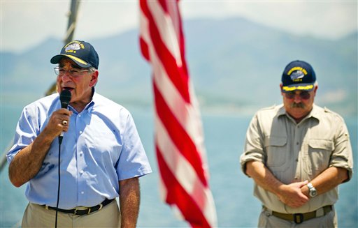 U.S. Secretary of Defense Leon Panetta, left, stands near USNS Richard E. Byrd Ship Master Captain John Sargent as he speaks to the crew aboard the cargo ship in Cam Ranh Bay, Vietnam, Sunday, June 3, 2012. Panetta visited the former U.S. air and naval base in the bay, becoming the most senior American official to go there since the war ended. (AP Photo/Jim Watson, Pool) HORIZONTAL