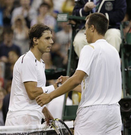 Lukas Rosol, right, of the Czech Republic is congratulated by Rafael Nadal of Spain after Rosol defeated Nadal in a second round men's singles match at the All England Lawn Tennis Championships at Wimbledon. The Associated Press photo
