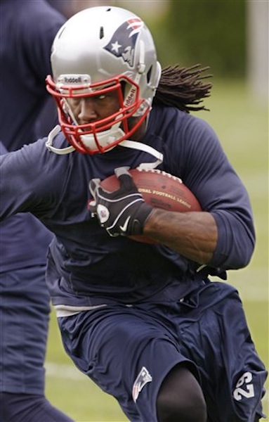 New England Patriots running back Joseph Addai carries the ball during practice at the NFL football team's facility in Foxborough, Mass., Thursday, June 7, 2012. (AP Photo/Stephan Savoia)