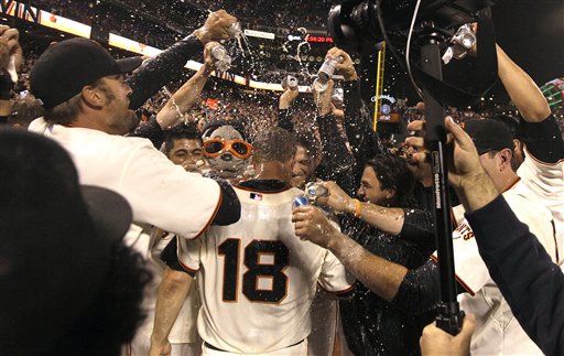 San Francisco Giants pitcher Matt Cain (18) celebrates with teammates after throwing a perfect game in a baseball game against the Houston Astros in San Francisco on Wednesday.
