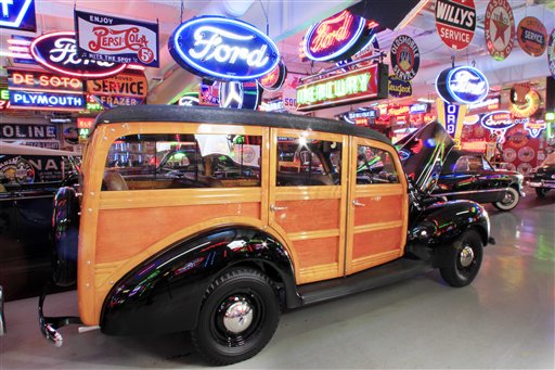 A 1940 Standard Station Wagon is among about 50 vintage cars, many from the 1930s and '40s, and numerous neon, porcelain and tin signs from a bygone era up for auction this weekend.