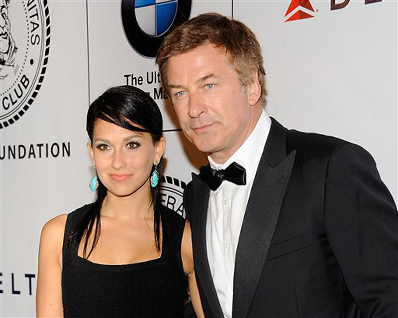 This June 12, 2012 file photo shows actor Alec Baldwin and his fiancee Hilaria Thomas at The Friars Club and Friars Foundation Honor of Tom Cruise at The Waldorf-Astoria in New York. A New York City news photographer says he was punched by Alec Baldwin outside a marriage license bureau in Manhattan. The Daily News reports that Marcus Santos was snapping images of the "30 Rock" star with his fiancÈe Hilaria Thomas Tuesday, June 19. Santos told the paper that Baldwin grabbed a second news photographer, then started shoving Santos and hit him in the chin. He then walked away. Photos on the newspaper's website appear to show Baldwin shoving the photographer. No police report has been filed. A call to the newspaper's public relations office wasn't returned. (Photo by Evan Agostini/Invision/AP, file) Half-Length