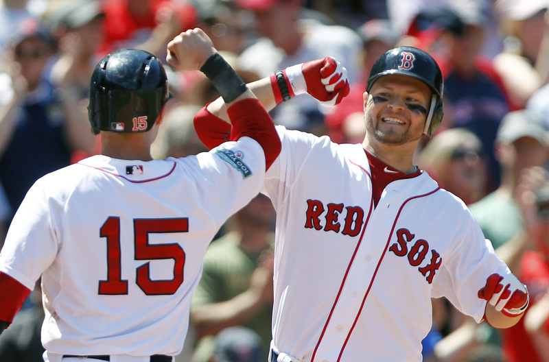 Cody Ross, right, celebrates his three-run home run with Dustin Pedroia (15) in the fourth inning against the Atlanta Braves Sunday in Boston. Ross hit a two-run homer in the fifth, and the Red Sox won, 9-4.