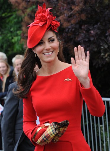 Britain's Kate, Duchess of Cambridge, prepares to board the royal barge as she and Prince William joined the Queen for the Diamond Jubilee Pageant on the River Thames in London today.