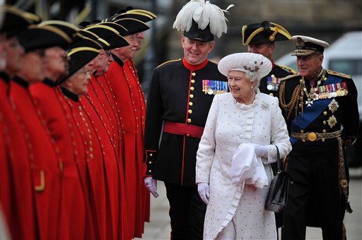 Britain's Queen Elizabeth II and Prince Philip, right, arrive at Chelsea Pier in London before boarding the royal barge to participate in the Diamond Jubilee River Pageant.