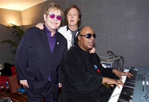 Sir Paul McCartney joins Sir Elton John and Stevie Wonder backstage at the Diamond Jubilee concert at Buckingham Palace in London on Monday.