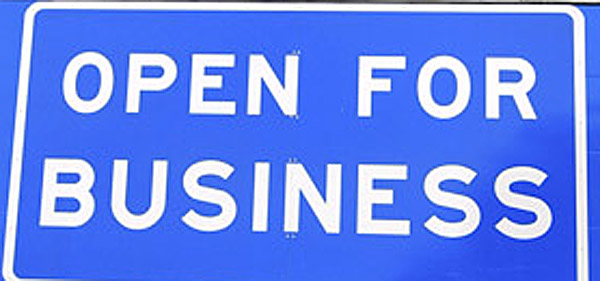 This photo shows an "Open for Business" sign on Interstate 95 in Kittery, beneath the "Welcome to Maine" sign, near the New Hampshire border. Gov. LePage had the sign made and posted after winning office. (AP Photo/Portsmouth Herald, Rich Beauchesne)