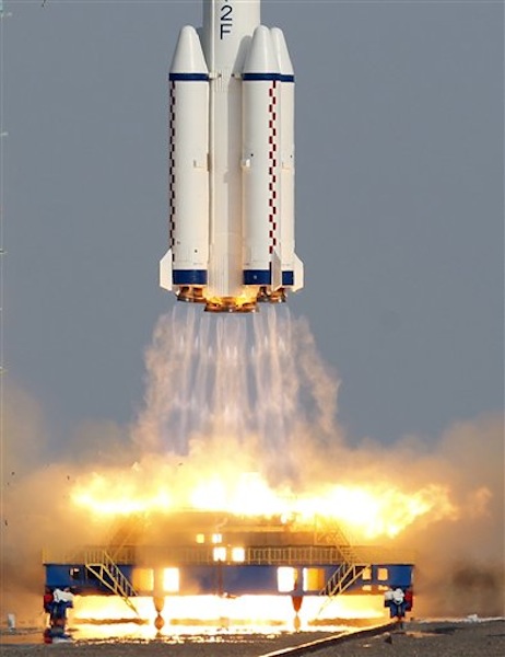 The Shenzhou 9 spacecraft rocket lifts off from the launch pad at the Jiuquan Satellite Launch Center in Jiuquan, China, Saturday, June 16, 2012. China sends its first woman and two other astronauts into space Saturday to work on a temporary space station for about a week, in a key step toward becoming only the third nation to set up a permanent base in orbit. (AP Photo/Ng Han Guan)