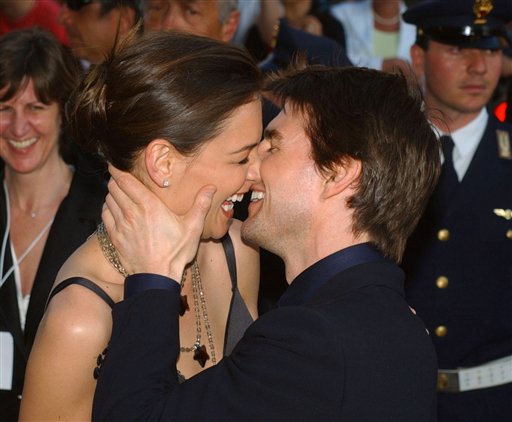 In this Friday April 29, 2005 file photo,Tom Cruise, right, and Katie Holmes laugh as they on Via della Conciliazione Boulevard near St. Peter's Basilica, as they arrive at the St. Cecilia auditorium for the David di Donatello Italian film awards, in Rome. Holmes' attorney Jonathan Wolfe said Friday June 29, 2012 that the couple is divorcing, but called it a private matter for the family. (AP Photo/Corrado Giambalvo, File)