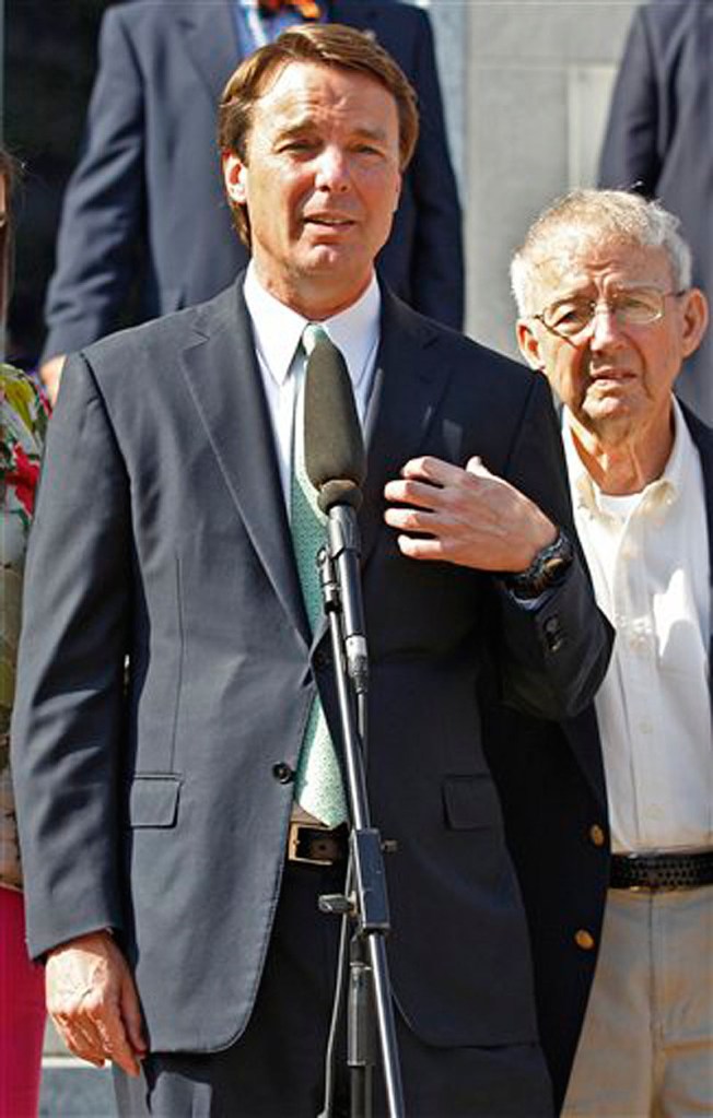 Ex-presidential candidate John Edwards speaks outside a federal courthouse as his father, Wallace Edwards, right, listen after his campaign finance fraud case ended in a mistrial May 31 in Greensboro, N.C. Jurors acquitted Edwards on one charge and deadlocked on the other five, unable to decide whether he used money from two wealthy donors to hide his pregnant mistress while he ran for president and his wife was dying of cancer.