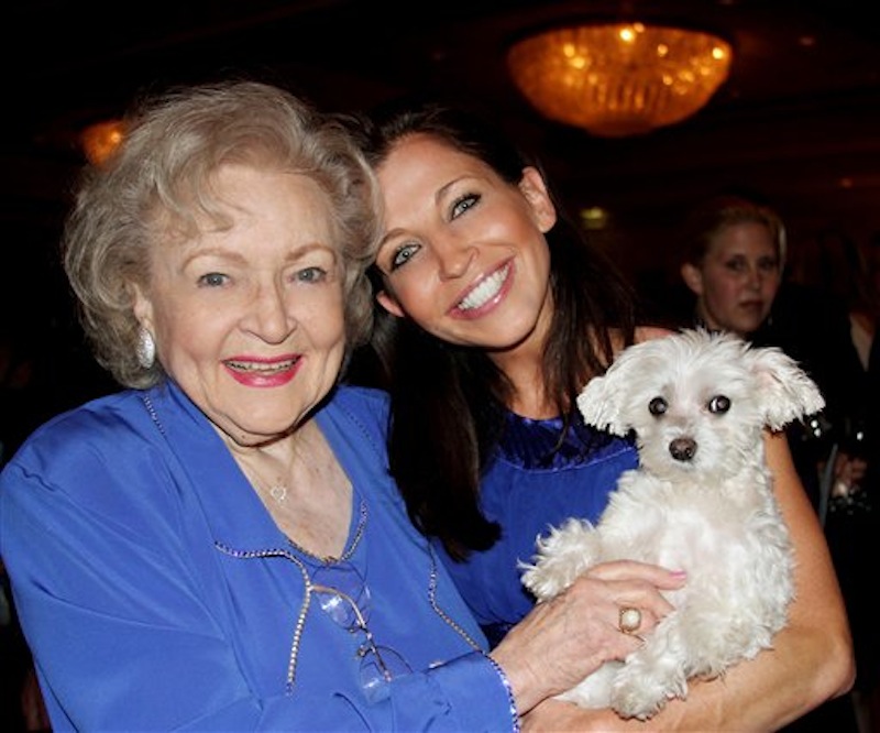 In this undated photo provided by Lucky Diamond Productions, Inc., actresses Betty White, left and Wendy Diamond hold Lucky Diamond. The fifteen-year-old Maltese who the Guinness Book of World Records credited was "the animal photographed with the most famous people," died at her home in New York on Tuesday, June 5, 2012 of spleen cancer. For over a decade, Lucky, and her owner Wendy Diamond, publicized the importance of adopting homeless animals and taking good care of them. (AP Photo/Lucky Diamond Productions, Inc.)