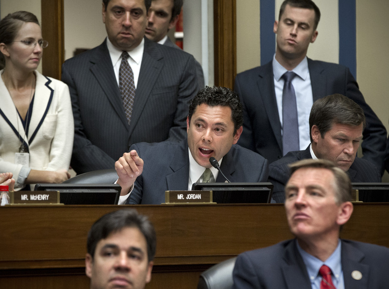 Rep. Jason Chaffetz, R-Utah, center, debates Rep. Stephen Lynch, D-Mass., Wednesday as the House Oversight and Government Reform Committee considers a vote to hold Attorney General Eric Holder in contempt of Congress.