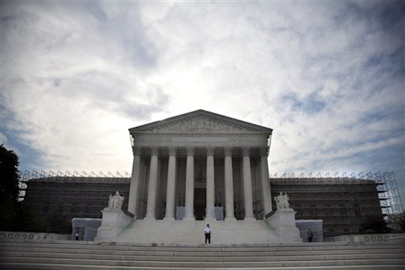 The Supreme Court in Washington, Monday, June 25, 2012. The Supreme Court ruled Monday that it is unconstitutional for state laws to require juveniles convicted of murder to be sentenced to life in prison without possibility of parole. (AP Photo/Evan Vucci)
