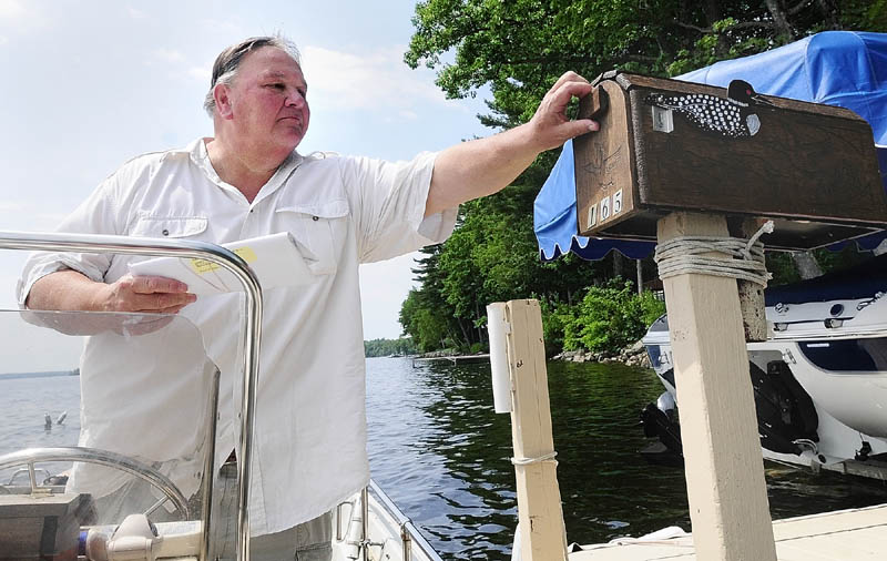 Norm Shaw has been delivering the mail from his boat on Great Pond in Belgrade and Rome for nine years.