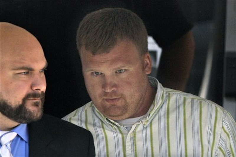In this June 20, 2012 file photo, Matt Sandusky, right, adopted son of former Penn State assistant coach Jerry Sandusky, leaves the Centre County Courthouse in Bellefonte, Pa., where his father was being tried on charges of child sexual abuse involving 10 boys over a period of 15 years. Matt Sandusky, who released a statement on June 22, 2012 that his father had sexually abused him as well, describes being abused as an 8-year-old boy by his father on a police interview tape obtained by NBC News. (AP Photo/Gene J. Puskar, File)