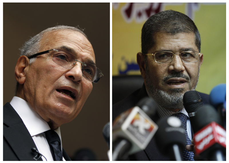 Egyptian presidential candidates Ahmed Shafiq, left, and Mohammed Morsi.