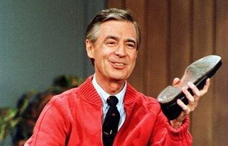 This June 28, 1989 file photo shows Fred Rogers as he rehearses the opening of his PBS show "Mister Rogers' Neighborhood" during a taping in Pittsburgh. Rogers, the late host of "Mister Rogers Neighborhood," is featured in a PBS Digital Studios video mashup that celebrates the power of imagination. The piece turns clips from Rogers show into a sweetly inspiring music video, "Garden of Your Mind." A PBS spokesman says the video posted Friday on PBS Digital Studios' YouTube channel is intended to get people talking about public television. More such tribute mashups are planned, spokesman Kevin Dando said. (AP Photo/Gene J. Puskar, File)