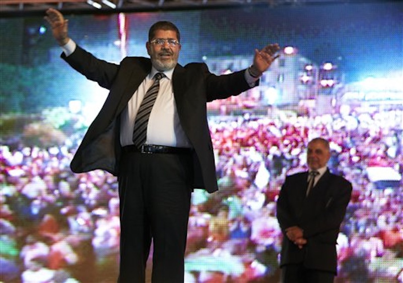 In this Sunday, May 20, 2012 file photo, presidential candidate Mohammed Morsi hold a rally in Cairo, Egypt. Egypt's electoral commission announced Sunday, June 24, 2012 that Morsi is victor of landmark presidential vote.(AP Photo/Fredrik Persson, File)