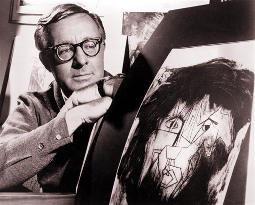 This Dec. 8, 1966, photo shows Ray Bradbury with a picture from a student project illustrating characters in a stage version of one of his dramas.