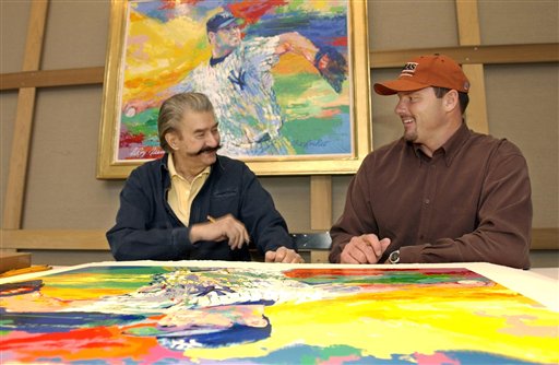 Leroy Neiman talks to then-New York Yankees pitcher Roger Clemens while signing limited edition serigraphs based on Neiman's painting "The Rocket," of Clemens on the mound in pinstripes in this Nov. 13, 2003, photo.