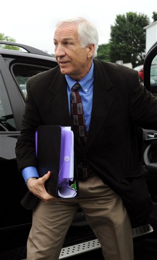 Jerry Sandusky arrives the courthouse for the second week of his trial at the Centre County Courthouse, in Bellefonte, Pa., Monday, June 18, 2012. (AP Photo/Centre Daily Times, Nabil K. Mark)
