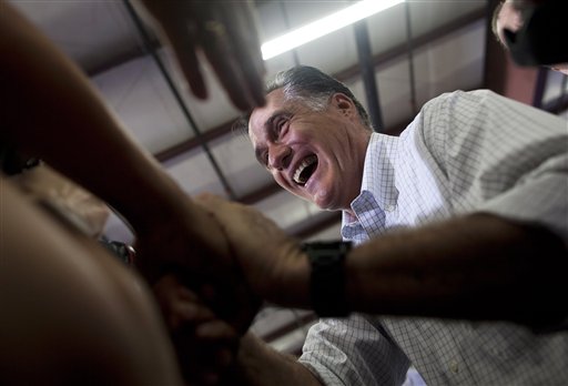 Republican presidential candidate Mitt Romney shakes hands during a campaign stop in Janesville, Wis., today. Obama carried the state by 14 points in 2008, but his campaign is clearly nervous now, and has moved the state from trending toward the president to undecided.