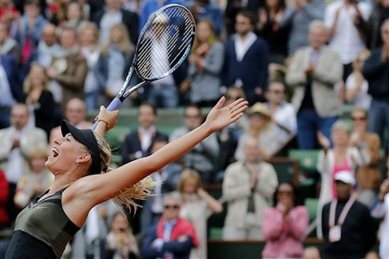 Russia's Maria Sharapova jumps after defeating Italy's Sara Errani in their women's final match in the French Open tennis tournament at the Roland Garros stadium in Paris, Saturday, June 9, 2012. Sharapova won 6-3, 6-2. (AP Photo/Michel Euler)
