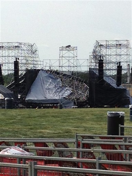 This photo provided by Alexandra Mihan shows a collapsed stage at the site for a Radiohead concert at Downsview Park in Toronto on Saturday June 16, 2012. Toronto paramedics say one person is dead and another is seriously hurt after the stage collapsed while setting up for a Radiohead concert. They say two other people were injured and are being assessed. (AP Photo/Alexandra Mihan via The Canadian Press)