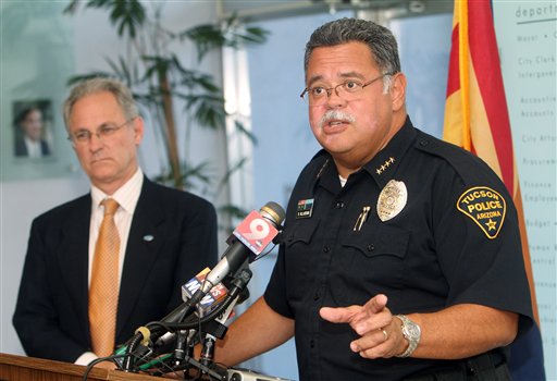 Tucson, Ariz., Mayor Jonathan Rothschild, left, listens to Tucson Chief of Police Roberto Villase during a news conference following the U.S. Supreme Court's ruling on Monday.