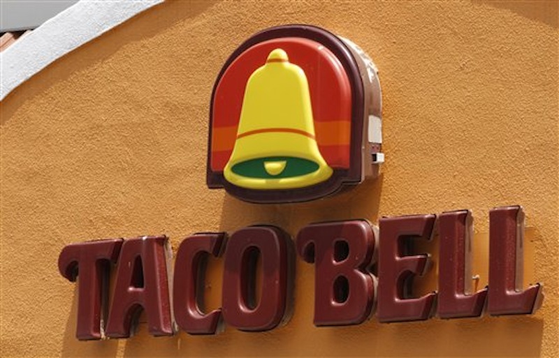 This Wednesday, June 6, 2012, file photo shows a Taco Bell restaurant in Richmond, Va. After a hoax had residents of Betlhel, Alaska thinking they would soon be getting Taco Bell, executives for the chain restaurant have arranged to fly enough ingredients from Anchorage to make 10,000 free tacos for a feast on Sunday, July 1, 2012. The city of 6,200 people is about 40 miles inland from the Bering Sea in far western Alaska, and the closest fast food other than a Subway sandwich shop is in Anchorage, 400 miles and a $500 round-trip plane ticket away. (AP Photo/Steve Helber, File)