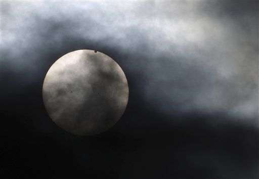 Venus begins to pass in front of the sun, as visible from New York on Tuesday.