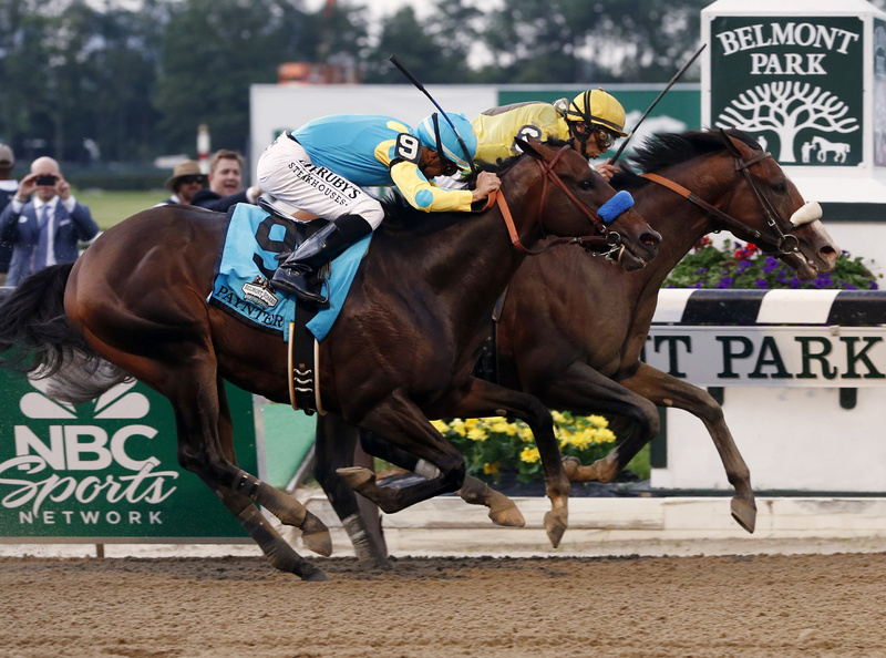 Union Rags with jockey John Velazquez, right, holds off Paynter with jockey Mike Smith to win the 144th Belmont Stakes horse race at Belmont Park in Elmont, N.Y., on Saturday.
