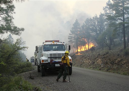 Firefighters work an area along the northwest perimeter of a massive blaze in the Gila National Forest in an isolated mountainous area of southwestern New Mexico.