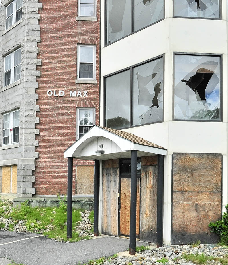 The Old Max building was built in 1908 and has many boarded up or broken windows.