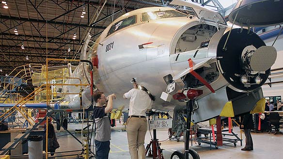 Bombardier employees work on a CRJ200 jet at the company's plant in Montreal.