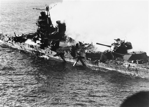 FILE - In this June 1942 file photo, a Mogami class Japanese cruiser is the flaming target of carrier-based U.S. naval aircraft in the historic battle of Midway which raged for three days in June 1942. On Monday, June 4, 2012, the Navy marks the 70th anniversary of a battle that turned the tide of World War II. (AP Photo, file) attack;battle of Midway;battleship;bombing;destruction;fire;Japa