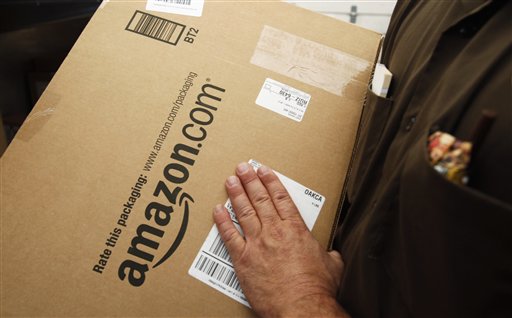 An Amazon.com package is prepared for shipment by a United Parcel Service driver in Palo Alto, Calif. The proposed Marketplace Fairness Act would require online merchants to collect sales taxes, just as their brick and mortar competitors have to do.