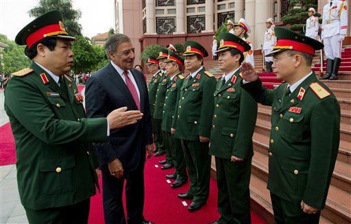 U.S. Defense Secretary Leon Panetta, second left, participates in an arrival ceremony with Vietnamese Defense Minister Phung Quang Thanh, left, at the Ministry of Defense in Hanoi, Vietnam Monday, June 4, 2012. (AP Photo/Jim Watson, Pool) HORIZONTAL