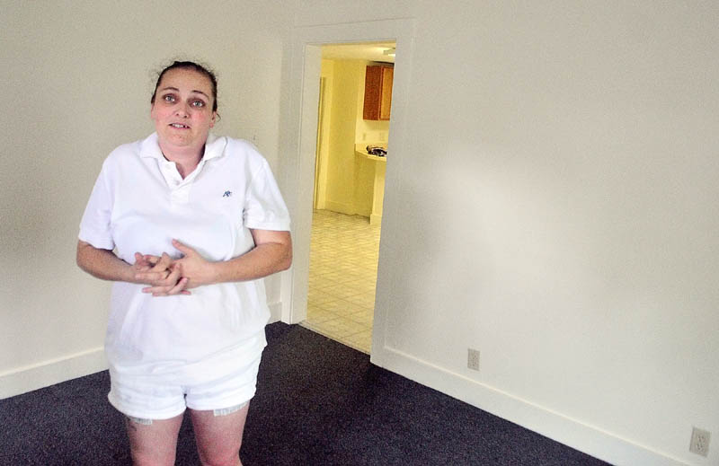 NEW HOME: Heather Bennett stands in the new Augusta apartment she found for her family on Wednesday afternoon a day after their old one on State Street was declared unfit for occupancy.