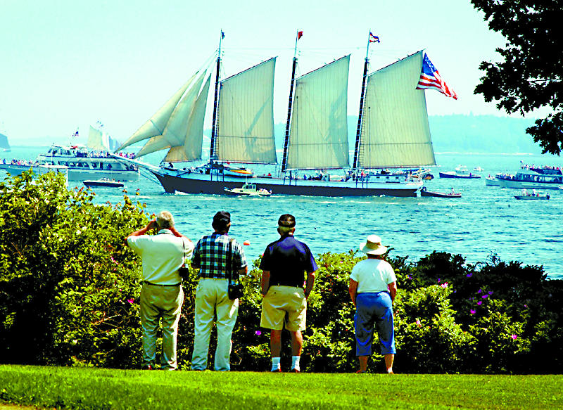 In this June 2003 file photo, the schooner Victory Chimes makes her way past visitors from New York and Florida as she closes in on Boothbay Harbor and the 41st annual Windjammer Days festivities in Boothbay Harbor.