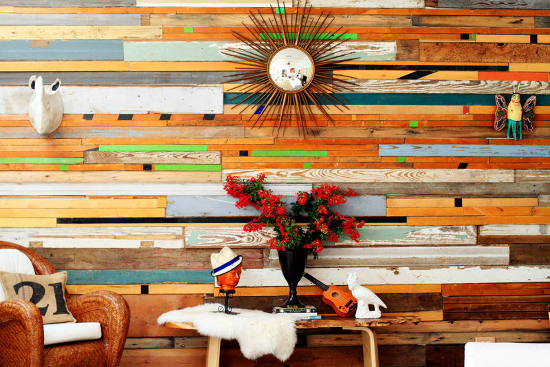 Sarah Reiss uses wood from gymnasiums, bowling alleys and barns, as well as shiplap, to craft her wall art and tables.