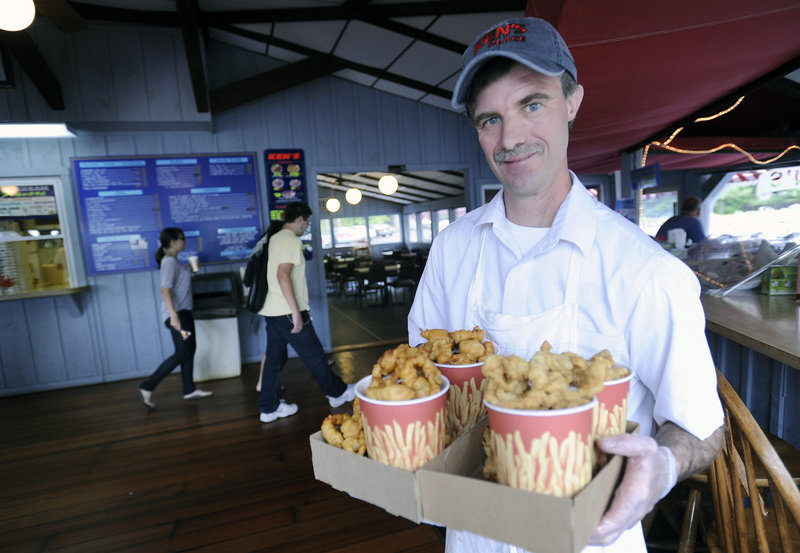 Dave Wilcox, owner of Ken’s Place in Scarborough, with a heaping helping of Ken’s fried clams, also voted best by readers.