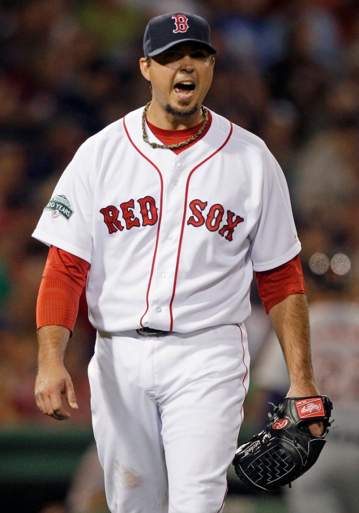 Josh Beckett yells as he leaves the mound in the seventh, his last inning in Thursday’s game at Fenway Park. Beckett allowed four runs and 10 hits in Boston’s 7-3 loss to Detroit. Beckett is 4-5.
