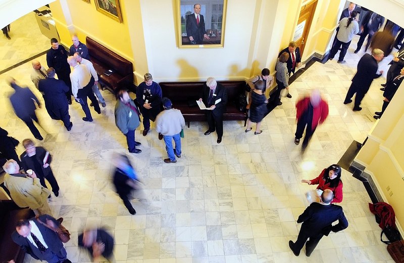 People move between the House and Senate chambers at the State House in Augusta. The right of citizens to interact with government is a core tenet of the U.S. Constitution.