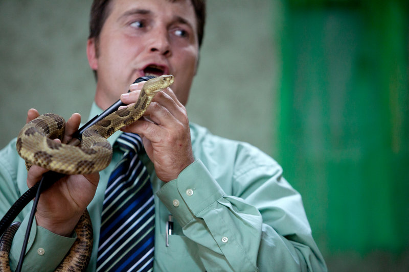 Pastor Mack Wolford handles a rattlesnake during a service at the Church of the Lord Jesus in Jolo, W.Va., on Sept. 2, 2011. He died Sunday after a rattler bit him at an outdoor service.