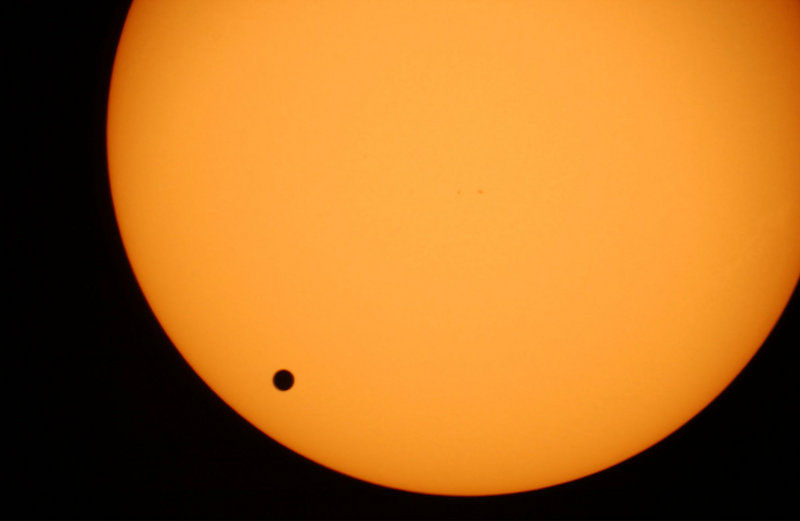 Venus, the black spot crossing the sun, is shown in a photo taken June 8, 2004. On Tuesday into Wednesday, another transit of Venus will be the last one until 2117.