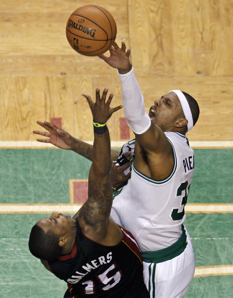 Paul Pierce, blocking a shot by Mario Chalmers of the Miami Heat, was a force in a balanced offense Friday night for the Boston Celtics, scoring 23 points in a had-to-have-it 101-91 victory in Game 3 at Boston.